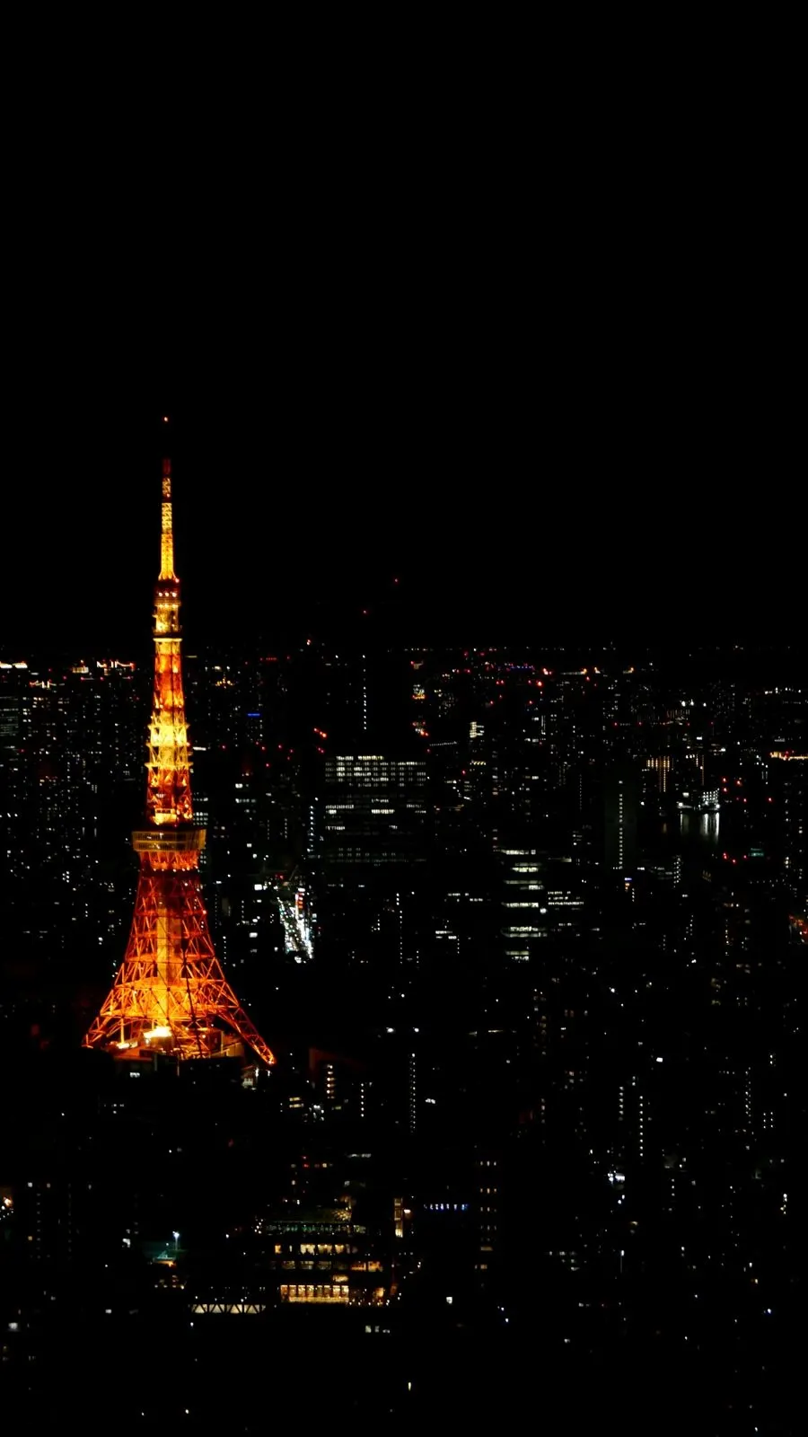 Tokyo Tower lit at night, seen from Roppongi Hills